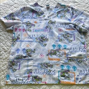 Disney Buzz Lightyear Scrub Top with Blue and Green Accents